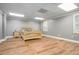 Bedroom featuring wood-look floors, natural light from window, and a neutral color palette at 2695 Moon Cabin Dr, Powder Springs, GA 30127