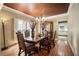 Formal dining room with a chandelier and window shutters at 2695 Moon Cabin Dr, Powder Springs, GA 30127