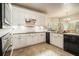 Well-equipped kitchen with white cabinets and updated appliances at 2695 Moon Cabin Dr, Powder Springs, GA 30127