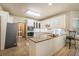 Bright kitchen with white cabinets, granite countertops, and stainless-steel appliances at 2695 Moon Cabin Dr, Powder Springs, GA 30127