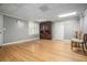 Spacious living area with wooden floors, natural light from a window and gray walls at 2695 Moon Cabin Dr, Powder Springs, GA 30127
