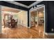 Open-concept living spaces featuring hardwood floors, a dining room, fireplace and stairway at 2695 Moon Cabin Dr, Powder Springs, GA 30127