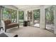 Relaxing sunroom featuring big windows that allow natural light to illuminate the room at 2695 Moon Cabin Dr, Powder Springs, GA 30127