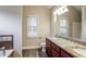 Bathroom with dual vanities, granite countertops, modern fixtures, and wood look flooring at 2082 Blackberry Ln, Auburn, GA 30011