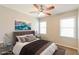 Staged bedroom featuring a large bed, plush bedding, and neutral walls with natural lighting at 2082 Blackberry Ln, Auburn, GA 30011