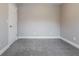 A bedroom with neutral paint, carpet flooring, and white trim provides a blank canvas for personalization at 2082 Blackberry Ln, Auburn, GA 30011