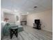 Finished basement with light wood flooring, a comfortable couch, and a TV area at 4601 Gann Sw Xing, Smyrna, GA 30082