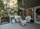 Charming deck with white wicker furniture, perfect for outdoor relaxation and entertaining at 4601 Gann Sw Xing, Smyrna, GA 30082