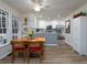 Bright dining area adjacent to the kitchen featuring a view into the kitchen at 4601 Gann Sw Xing, Smyrna, GA 30082