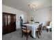 Formal dining room featuring a chandelier and wainscotting, creating an elegant ambiance at 4601 Gann Sw Xing, Smyrna, GA 30082