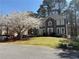Charming home with a well-manicured lawn, flowering tree, and inviting curb appeal at 4601 Gann Sw Xing, Smyrna, GA 30082
