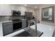 Bright kitchen featuring stainless steel appliances, ample counter space, and stylish gray subway tile backsplash at 4601 Gann Sw Xing, Smyrna, GA 30082