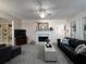 Comfortable living room with a ceiling fan, fireplace, and built-in shelving on the other side at 4601 Gann Sw Xing, Smyrna, GA 30082