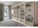 Bright living room with large windows and built-in bookshelves for ample display space at 4601 Gann Sw Xing, Smyrna, GA 30082