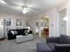 Bright living room featuring large windows and a seamless transition to the dining area at 4601 Gann Sw Xing, Smyrna, GA 30082