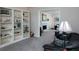 Inviting living room with built-in bookshelves and a cozy fireplace view to the next room at 4601 Gann Sw Xing, Smyrna, GA 30082