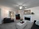 Cozy living room with a fireplace, large TV, and comfortable seating arrangement at 4601 Gann Sw Xing, Smyrna, GA 30082