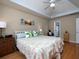 Comfortable main bedroom featuring hardwood floors, tray ceiling, and bright natural light at 4601 Gann Sw Xing, Smyrna, GA 30082