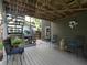 Spacious patio area with overhead deck offering an ideal space for outdoor gatherings at 4601 Gann Sw Xing, Smyrna, GA 30082