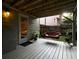 Covered patio featuring a cozy hanging sofa seat and a view of the backyard at 4601 Gann Sw Xing, Smyrna, GA 30082