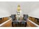 Bright dining room with a long, dark table, pendant lighting, and mirrored accents at 538 Sarabrook Pl, Sandy Springs, GA 30342