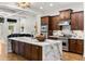 Modern kitchen with marble countertops, a stainless steel range, and custom cabinetry at 538 Sarabrook Pl, Sandy Springs, GA 30342