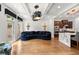 Open-concept space featuring a modern blue sofa and a kitchen with a marble island at 538 Sarabrook Pl, Sandy Springs, GA 30342