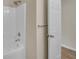 A close-up of the shower and bathtub in a bathroom featuring a white showerhead at 70 Prince Edward Way, Covington, GA 30016