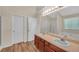 Bathroom featuring a double vanity, soaking tub, and enclosed shower at 70 Prince Edward Way, Covington, GA 30016