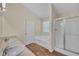 Bathroom with a double sink vanity, soaking tub, and shower at 70 Prince Edward Way, Covington, GA 30016