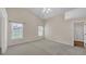 Spacious bedroom with neutral walls, carpet flooring, and natural light at 70 Prince Edward Way, Covington, GA 30016