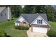Charming home with brick accents, a two-car garage, and well-maintained landscaping at 70 Prince Edward Way, Covington, GA 30016
