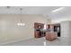 Open kitchen with an island, dark appliances, and tile flooring at 70 Prince Edward Way, Covington, GA 30016