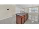 The kitchen island features granite countertops and storage space at 70 Prince Edward Way, Covington, GA 30016