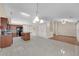 Spacious kitchen with a large island, tile flooring, and stainless steel appliances at 70 Prince Edward Way, Covington, GA 30016