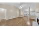Spacious living room with hardwood floors, a fireplace, and plenty of natural light from the windows at 70 Prince Edward Way, Covington, GA 30016