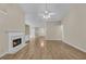 Bright living room boasting hardwood floors, fireplace, and open floor plan at 70 Prince Edward Way, Covington, GA 30016