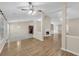 View of the living room featuring a fireplace, tile flooring, and adjoining kitchen at 70 Prince Edward Way, Covington, GA 30016