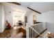 Bonus room with hardwood floors, white brick accents, desk and bookshelf, natural lighting, and guitars at 1448 N Highland Ne Ave, Atlanta, GA 30306