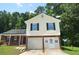 Charming two-story home featuring a garage, well-maintained lawn and an inviting front entrance at 2172 Cold Springs Cir, Lithonia, GA 30058