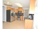 Modern kitchen with stainless steel appliances, tile floors, and wood cabinets at 2172 Cold Springs Cir, Lithonia, GA 30058