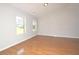 Bright living room featuring hardwood floors, neutral paint, and lots of natural light at 2172 Cold Springs Cir, Lithonia, GA 30058