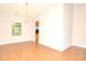 Living room with hardwood floors, a chandelier, and a view through to the Kitchen at 2172 Cold Springs Cir, Lithonia, GA 30058