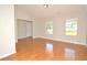 Spacious living room with hardwood floors, neutral paint, and abundant natural light at 2172 Cold Springs Cir, Lithonia, GA 30058