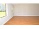 Bright living room featuring hardwood floors, neutral paint, and large windows at 2172 Cold Springs Cir, Lithonia, GA 30058