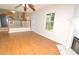 Open living room view to the kitchen and fireplace at 2172 Cold Springs Cir, Lithonia, GA 30058