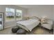 Bright bedroom featuring two windows, a decorative bed frame, and stylish furnishings at 2820 Aralynn Way, Atlanta, GA 30337