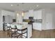 Modern kitchen featuring an island with bar seating, stainless steel appliances, and ample cabinet space at 2820 Aralynn Way, Atlanta, GA 30337