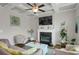 Cozy living room features a fireplace, coffered ceiling, plush seating, and ample natural light at 2820 Aralynn Way, Atlanta, GA 30337