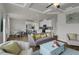 Open-concept living and dining area with hardwood floors, stylish furniture, and modern lighting at 2820 Aralynn Way, Atlanta, GA 30337